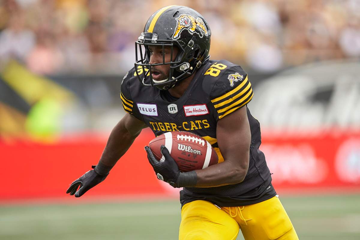 Hamilton's Bralon Addison runs the ball during the third quarter of the CFL's Labour Day Classic between the Ticats and the Toronto Argonauts in Hamilton, Ontario on Monday, September 2, 2019.