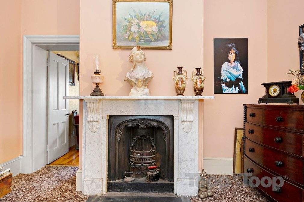 Rocker Alice Cooper, right, is shown in a painting on the wall of the Woodforde House in South Australia.