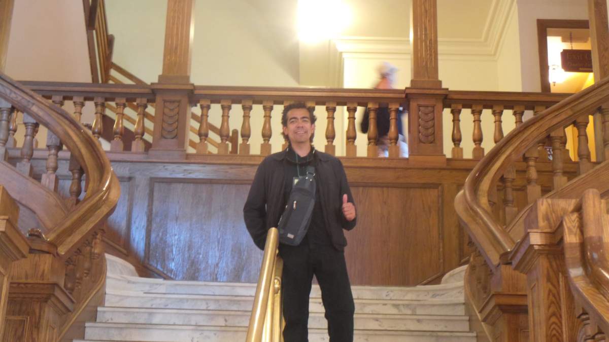 Arturo Martinez poses for a picture at Boldt Castle. The photo was snapped by the woman he met and was searching for.