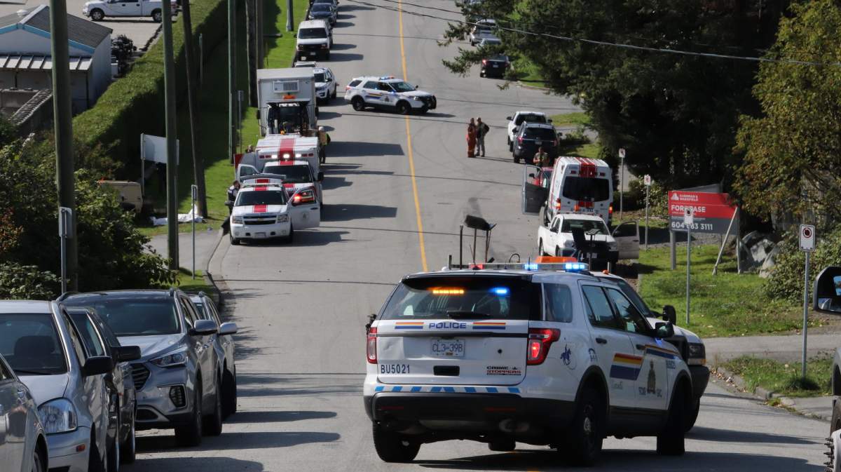 Police, ambulance and WorkSafeBC crews investigate a fatal workplace accident involving a City of Vancouver street worker in Burnaby on Sept. 28, 2019.
