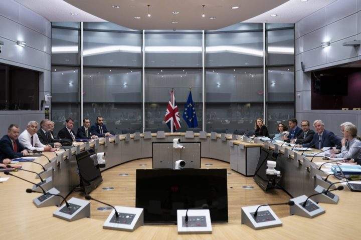 Britain's Brexit Secretary Stephen Barclay, second left, sits along with his team during a meeting with European Union chief Brexit negotiator Michel Barnier, second right, at the European Commission headquarters in Brussels, Friday, Sept. 20, 2019.
