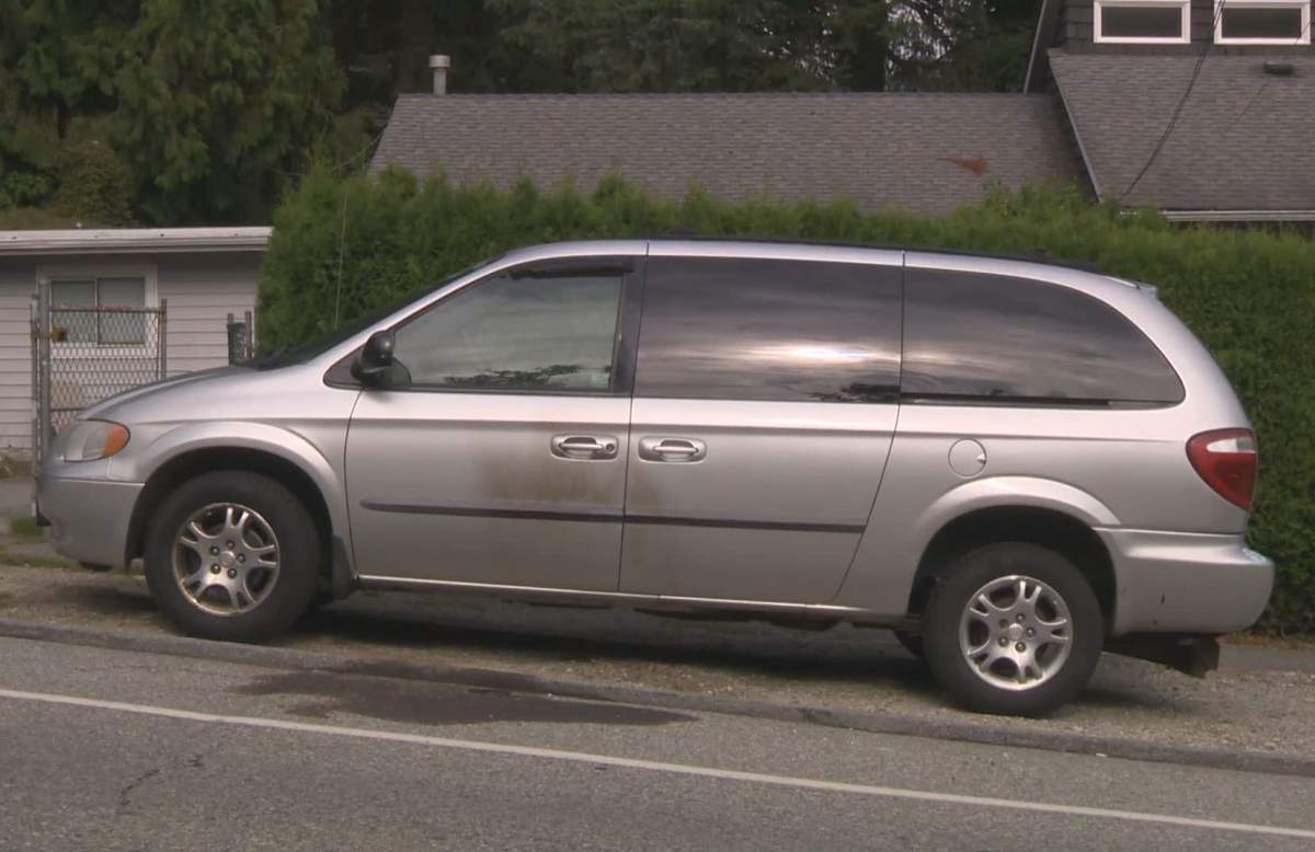 Scorch marks can be seen on ground and the side of a minivan parked in a Surrey neighbourhood on Sept. 1, 2019.
