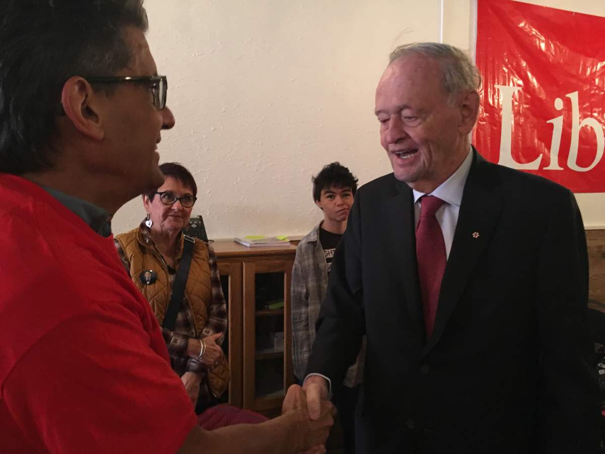 Former Prime Minister Jean Chrétien shakes hands with volunteers at the Kelowna Lake-Country campaign office for liberal incumbent Stephen Fuhr Friday morning.