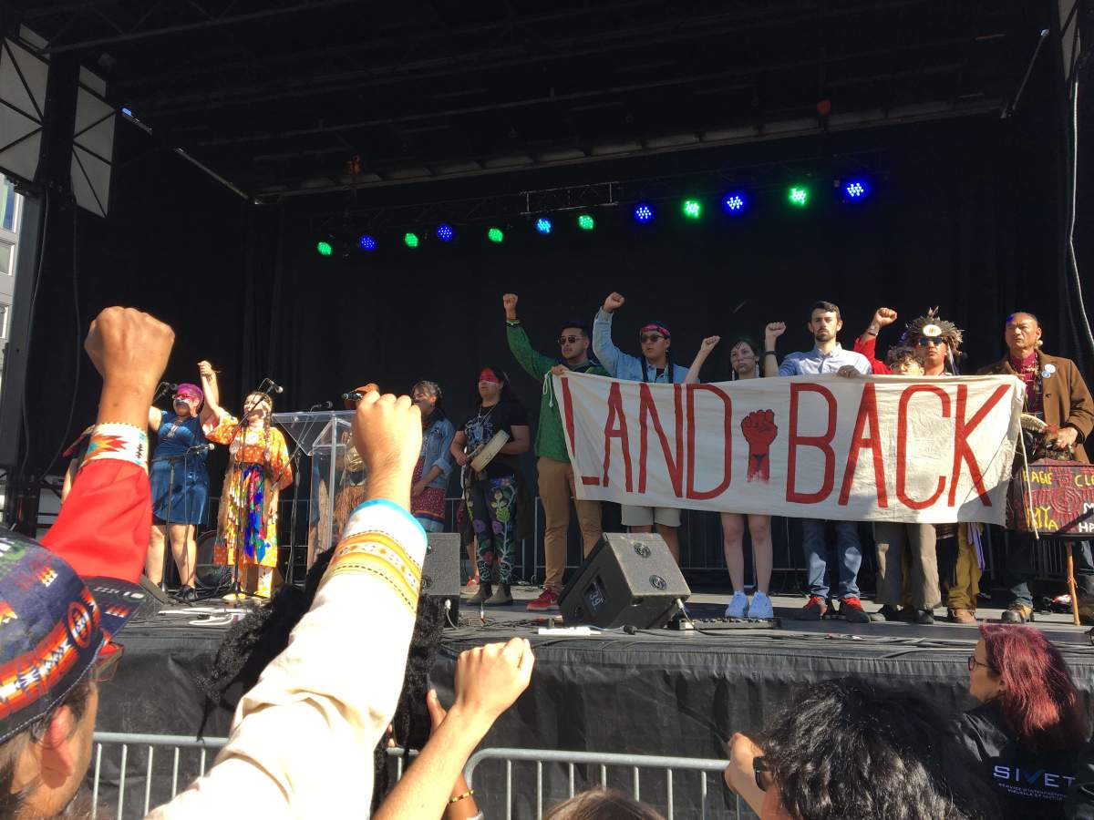 Protesters on stage at the end of the climate change protest in Montreal on Sept. 27, 2019.