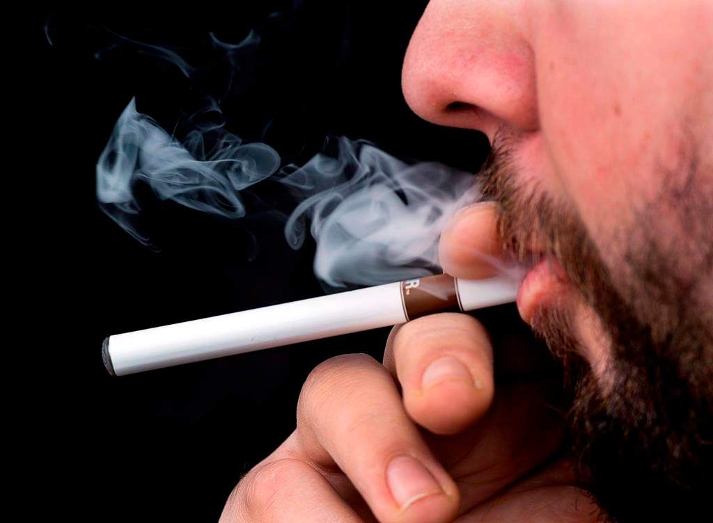 The Saskatchewan Government says it's keeping an eye out for vaping-related illnesses after a serious case was reported in Ontario and hundreds more cases have been recorded in the United States including seven deaths. A smoker puffs on an electronic cigarette in Halifax on Friday, Feb. 7, 2014. THE CANADIAN PRESS/Andrew Vaughan.