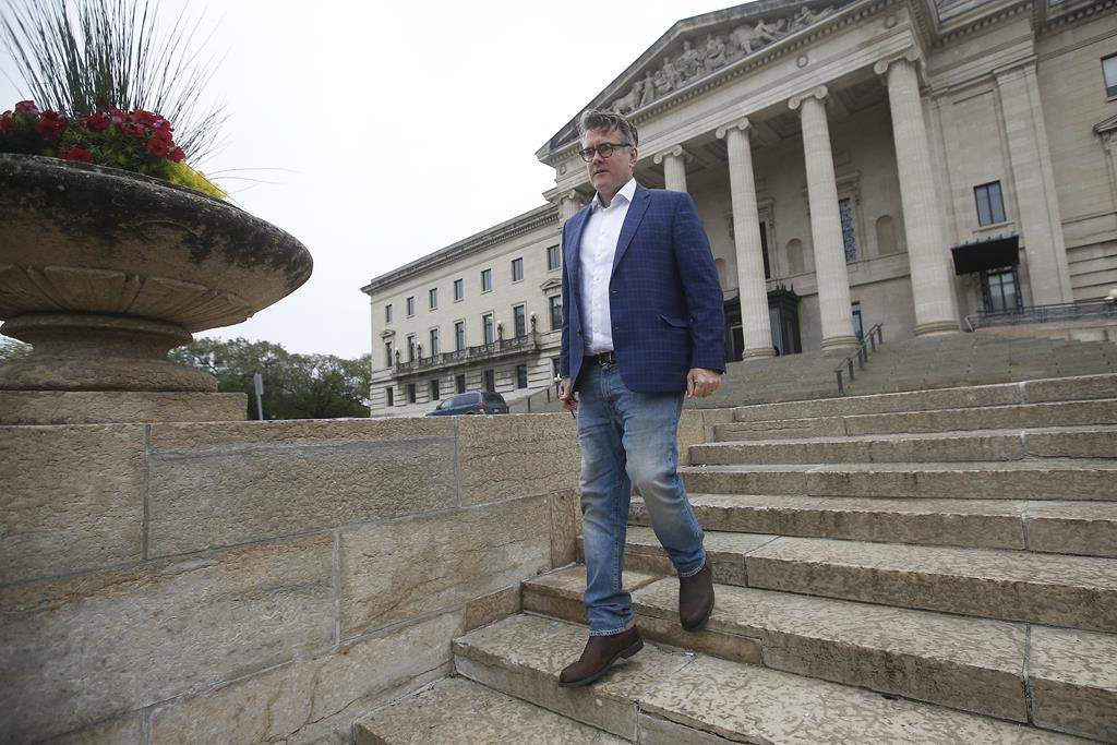 Manitoba Liberal Party Leader Dougald Lamont walks to a media interview on election day outside the Manitoba Legislature in Winnipeg, Tuesday, September 10, 2019. Lamont says he plans to stay on as leader after the Manitoba Liberals lost official party status retaining only three seats in Tuesday's election. THE CANADIAN PRESS/John Woods.