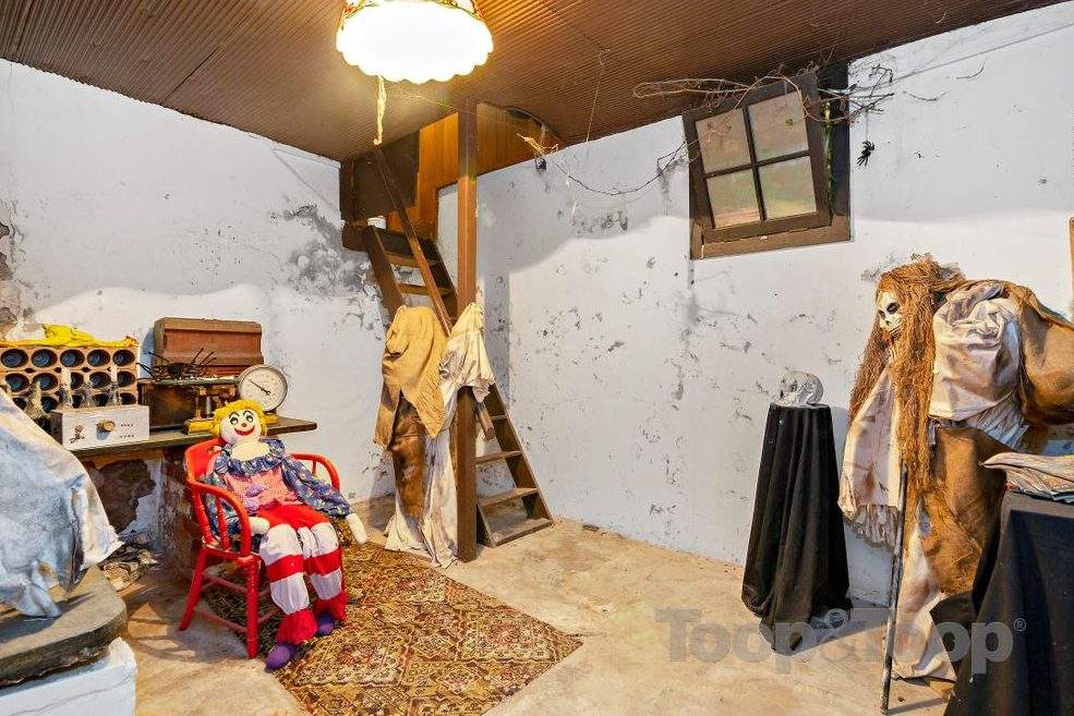 Several ghoulish figures are shown inside the Woodforde House in South Australia in this image from a real estate listing.