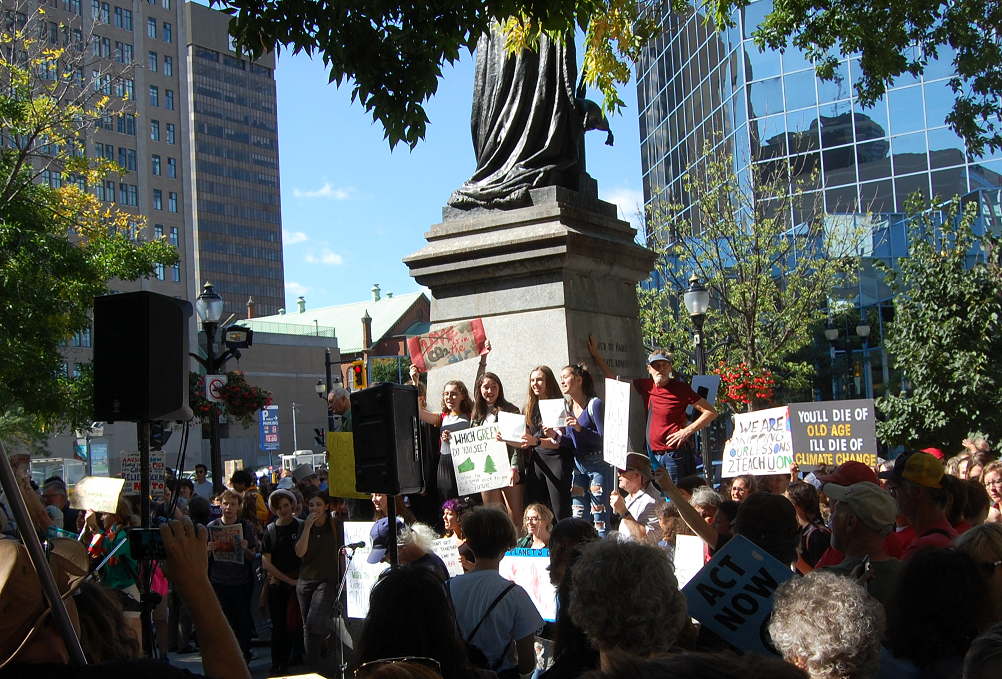 Gore Park was flooded with people for Hamilton's climate strike on Friday.
