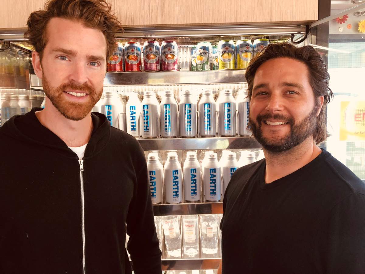 Earth Group co-founders Matt Moreau and Kori Chillibeck pose with their first batch of aluminum Earth Water products.