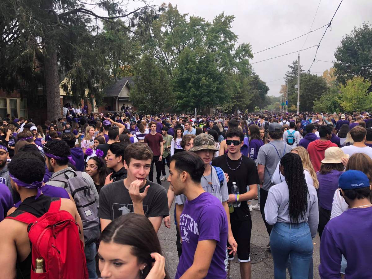Thousands of students and partiers gather along Broughdale Avenue to celebrate 2019's unsanctioned Fake Homecoming (FOCO) at Western University in London, Ont. Authorities in London are preparing for a rowdy weekend, Sept. 16-17, 2023.