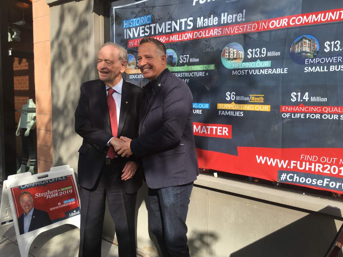 Former Prime Minister Jean Chrétien and liberal incumbent candidate for Kelowna Lake-Country Stephen Fuhr pose for a photo outside of Fuhr\’s campaign office Friday morning.