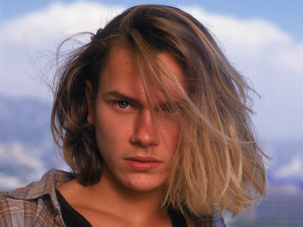 Outdoor headshot portrait of American actor River Phoenix (1970-93), 1991.