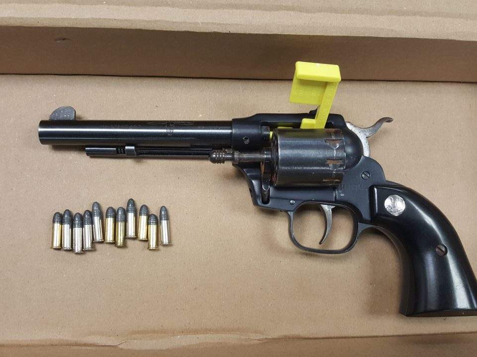 Police allege this gun was recovered from the vehicle after the chase.