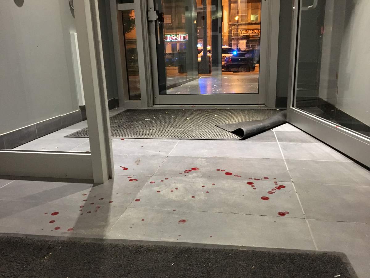 Blood on the floor in the entranceway of The Avenue apartment building.