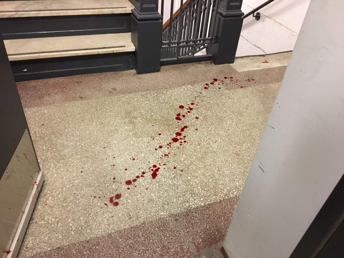 Blood near the stairwell inside the apartment.