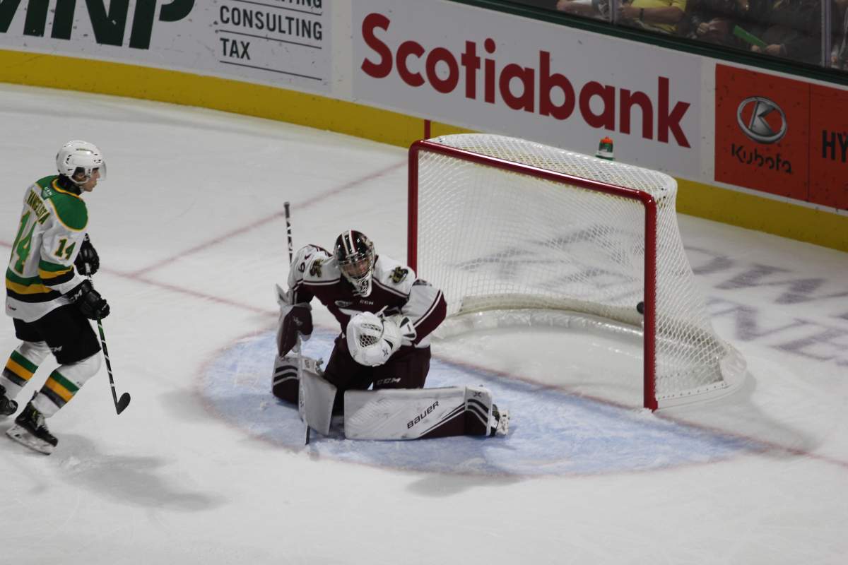 A Hunter Skinner shot finds its way past Hunter Jones of the Peterborough Petes at Budweiser Gardens on Sept. 20, 2019.