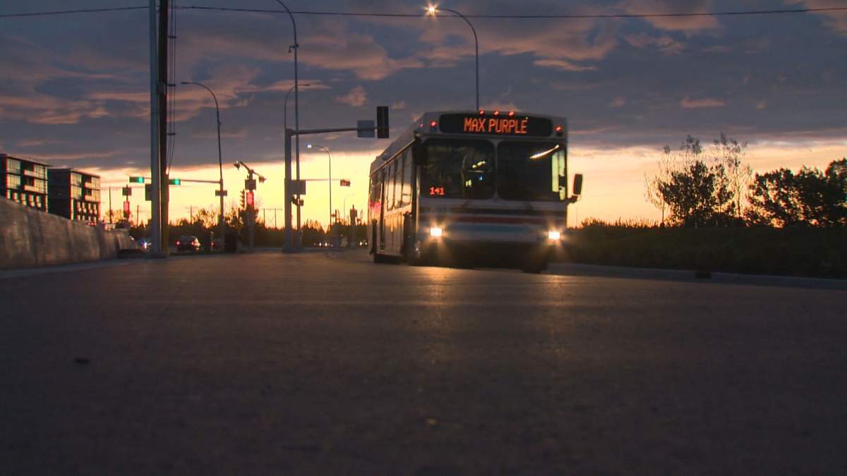A MAX Purple bus travelling down International Avenue Southeast.
