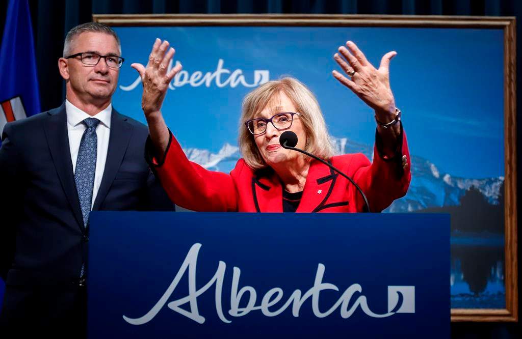Janice MacKinnon, right, chair of the Blue Ribbon Panel on Alberta’s Finances, and Travis Toews, Minister of Finance, speaks to the media about the MacKinnon Panel report on Alberta’s Finances in Calgary, Alta., Tuesday, Sept. 3, 2019.THE CANADIAN PRESS/Jeff McIntosh.