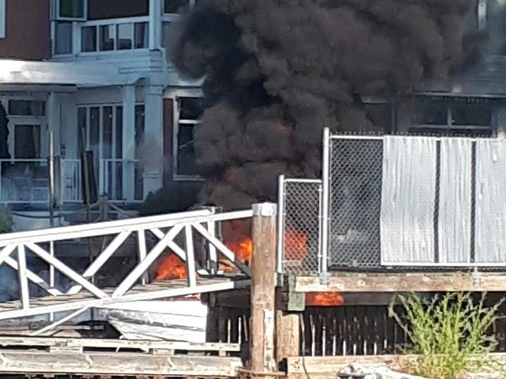 Thick, black smoke billows from a boat fire in Kelowna on Saturday afternoon. The fire was quickly extinguished.