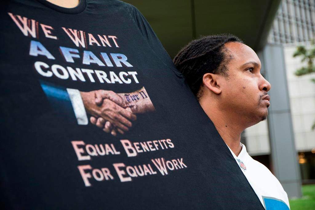 Sean Crawford, of United Auto Workers 598, rallies outside the Marriott Renaissance Hotel while the UAW GM Council holds a meeting inside the hotel in Detroit, Sunday Sept. 15, 2019.