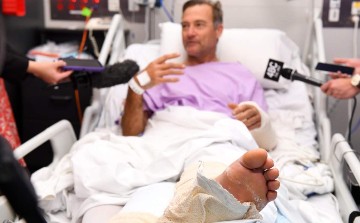 Australian Neil Parker was hiking when he took a 19-foot fall, snapping his leg.