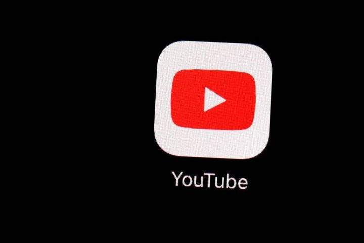 FILE - This March 20, 2018, file photo shows the YouTube app on an iPad in Baltimore. A published report says Google will pay more than $150 million to settle a complaint with the Federal Trade Commission over how it treats information from children on its video streaming site, YouTube. Politico reported Friday, Aug. 30, 2019 that the company would pay between $150 million to $200 million to settle the complaint. The FTC declined to comment and Google did not immediately comment.(AP Photo/Patrick Semansky, File).