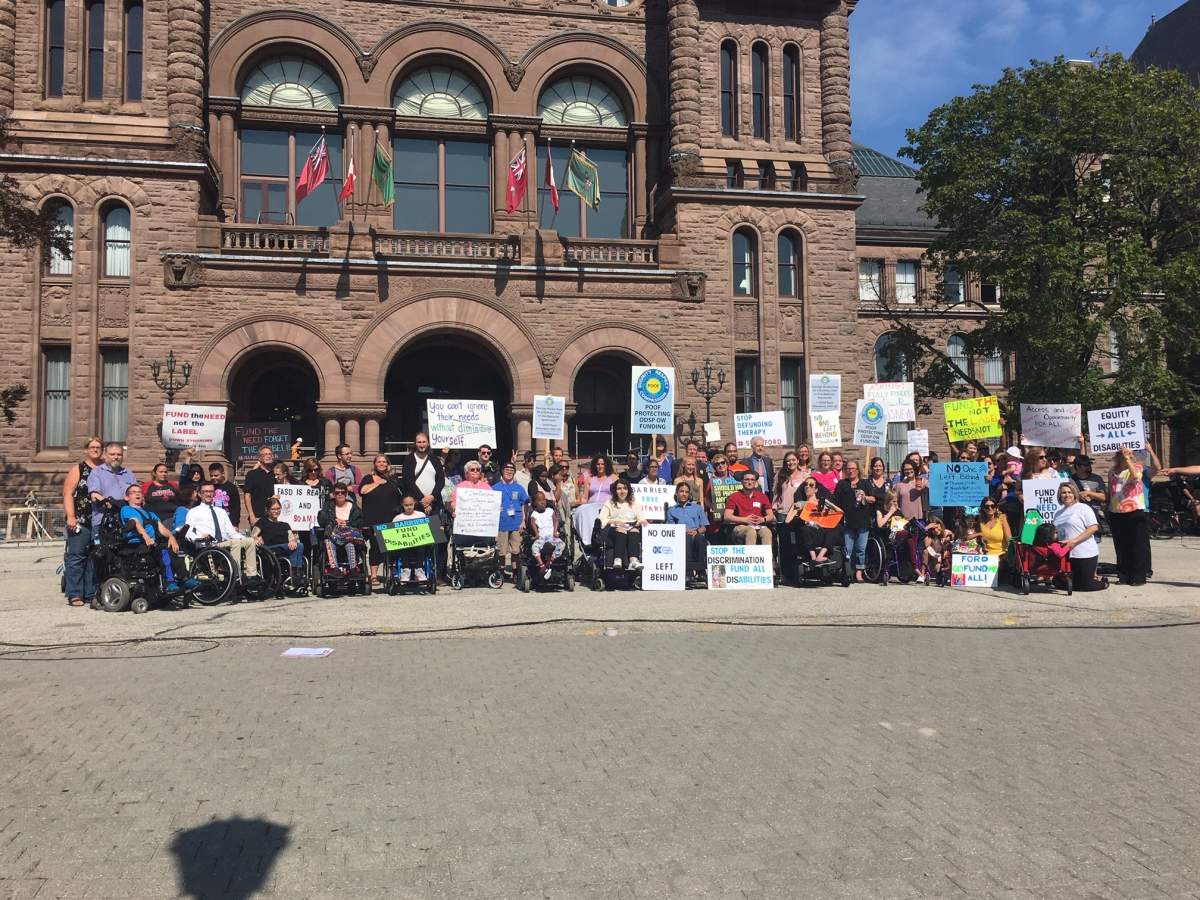People with disabilities and their families gather at Queen’s Park to call for better funding for services.