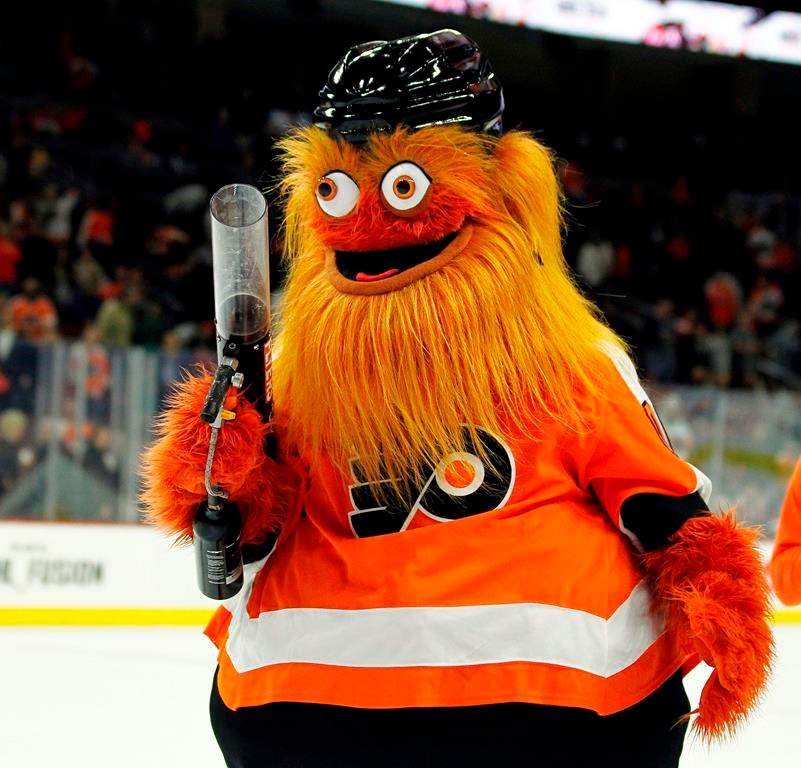 In this Sept. 24, 2018, file photo, the Philadelphia Flyers mascot, Gritty, takes to the ice during the first intermission of the Flyers' preseason NHL hockey game against the Boston Bruins in Philadelphia.