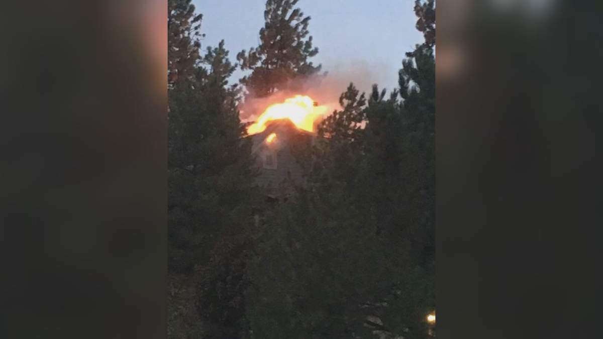 A house in Peachland caught fire after lightning hit a nearby tree. 