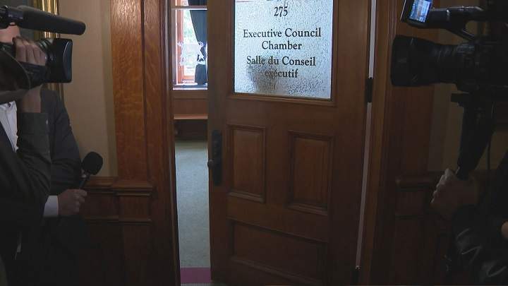 A photo of media waiting outside the Executive Council Chamber at Queen's Park in Toronto.