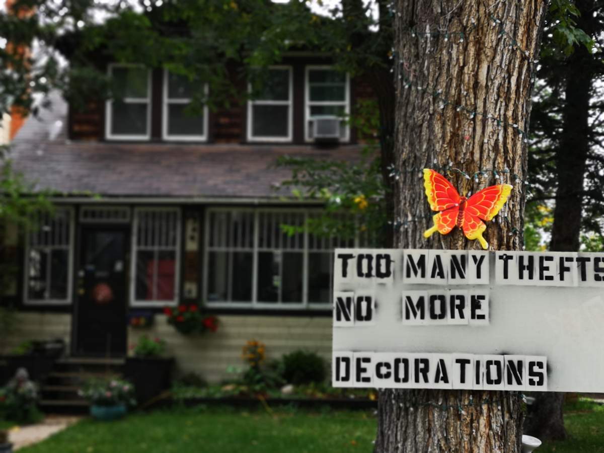 A sign dictates Roch Dupont’s clear intentions to stop decorating his lawn.