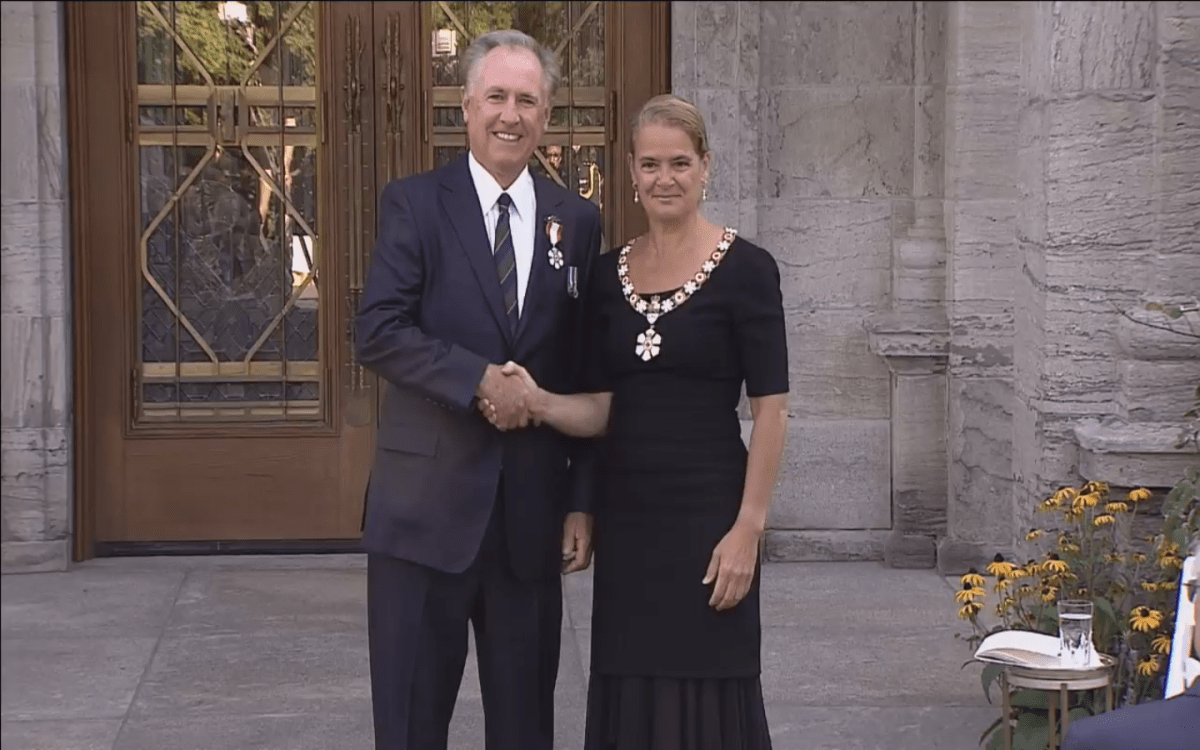 Ron Foxcroft receiving the Order of Canada medal from Governor General Julie Payette.