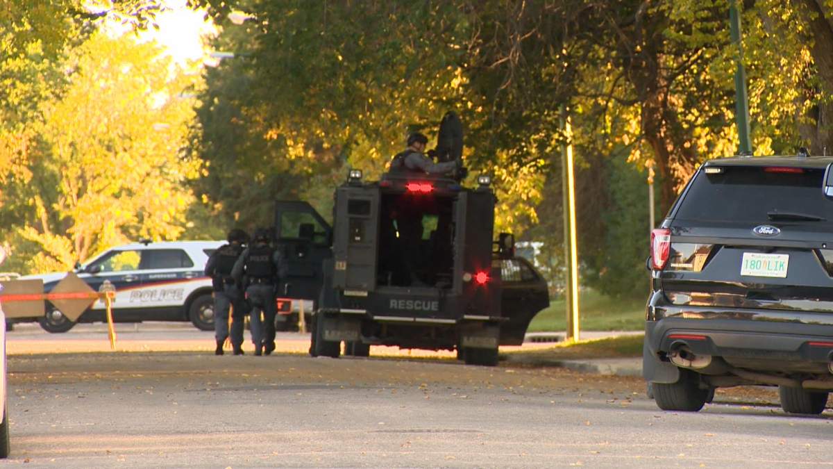 Saskatoon police said a man was spotted in a residence armed with a firearm and that he barricaded himself inside.