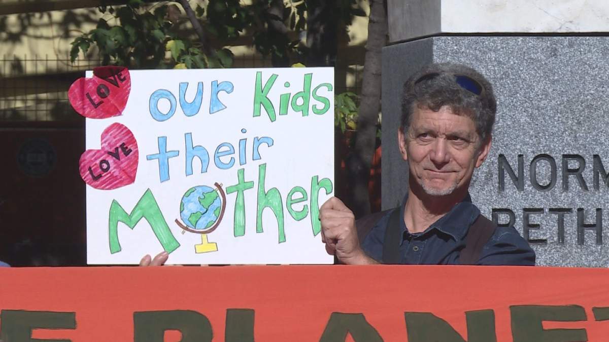 Seniors presented homemade signs during the Montreal climate-change march on Friday.