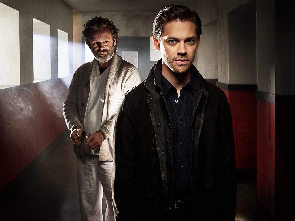From left to right: Michael Sheen and Tom Payne.