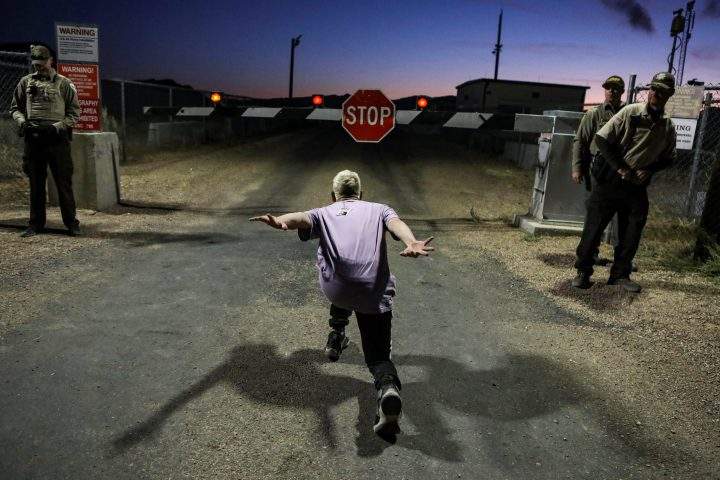 A man poses as if he is going to “Naruto run” at an entrance to Area 51 as an influx of tourists responded to a call to ‘storm’ Area 51, a secretive U.S. military base near Rachel, Nev., on September 20, 2019.