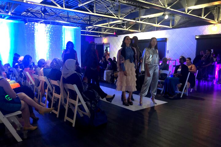 Models walk the ramp at the 2019 IMFDF show in Toronto.