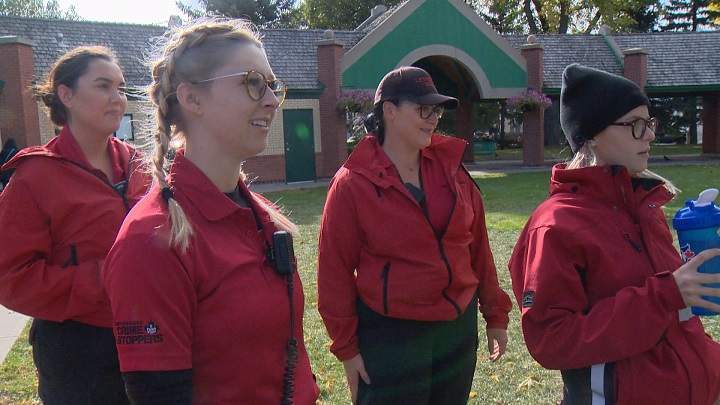 A team from The Watch stops to chat with people in Galt Gardens Tuesday.