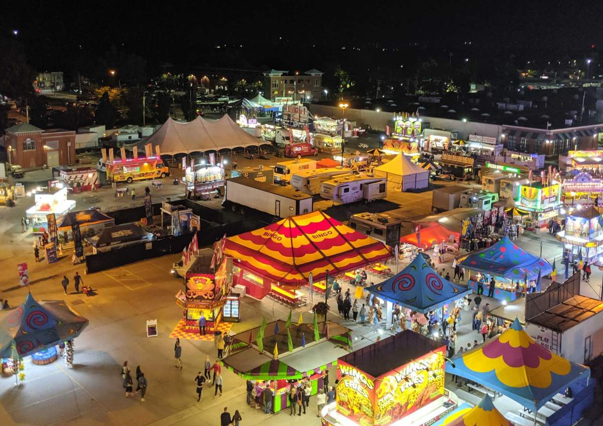 FILE - A portion of the midway of the 144th Western Fair on its opening night on Sept. 6, 2019. 
