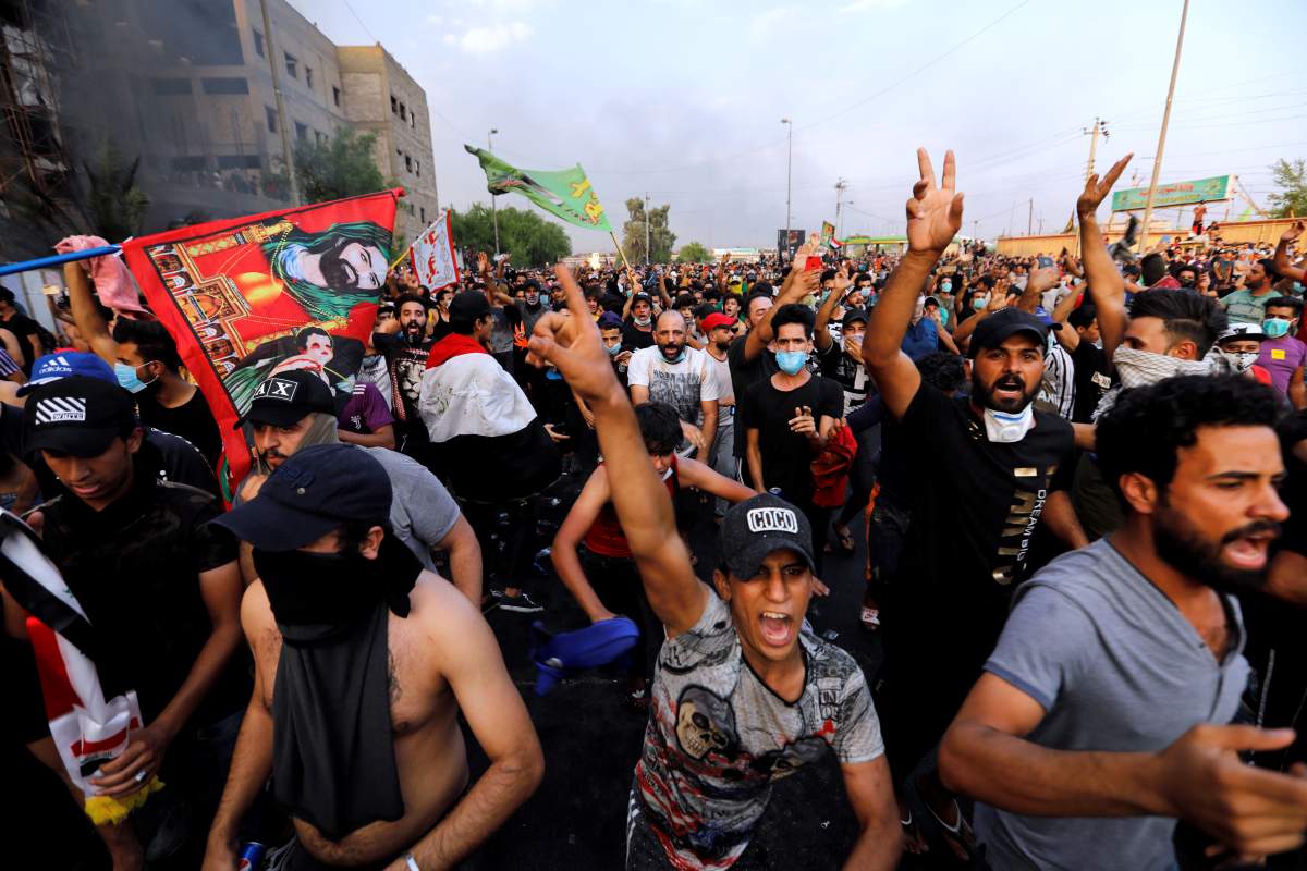 Demonstrators gesture at a protest over unemployment, corruption and poor public services in Baghdad, Iraq, Oct. 2, 2019. REUTERS/Thaier al-Sudani