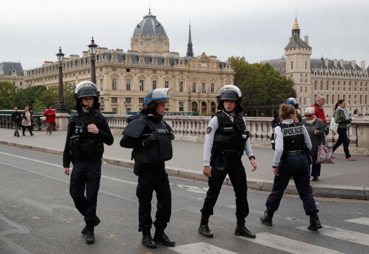 French police secure the area in front of the Paris police headquarters in Paris, France, Oct. 3, 2019.