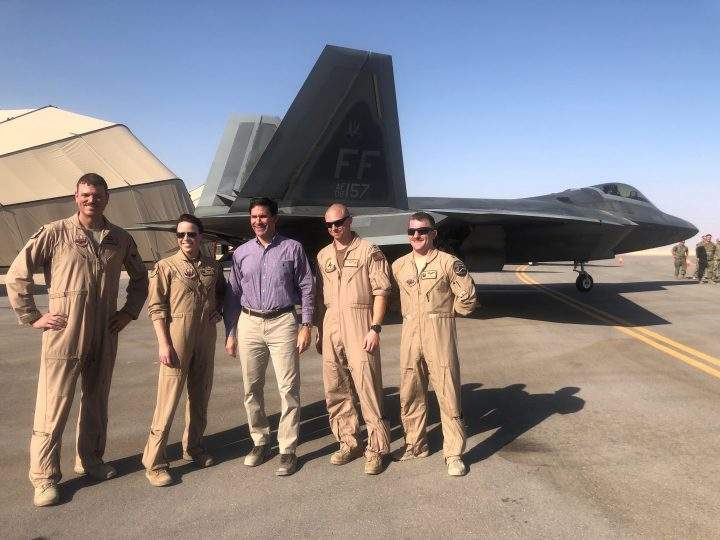 U.S. Defense Mark Esper speaks with U.S. troops in front of an F-22 fighter jet deployed to Prince Sultan Air Base in Saudi Arabia Oct. 22, 2019. 