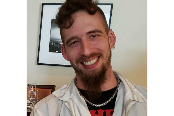Alex Courtemanche is described six feet three inches tall with a slender build, brown eyes and visible tattoos.