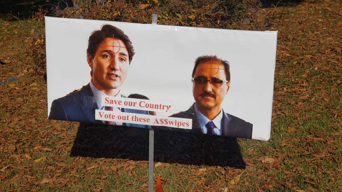 A sign on a lawn in southeast Edmonton showing Liberal leader Justin Trudeau and Edmonton Mill Woods candidate Amarjeet Sohi with crosshair targets on the foreheads. Thursday, October 3, 2019.