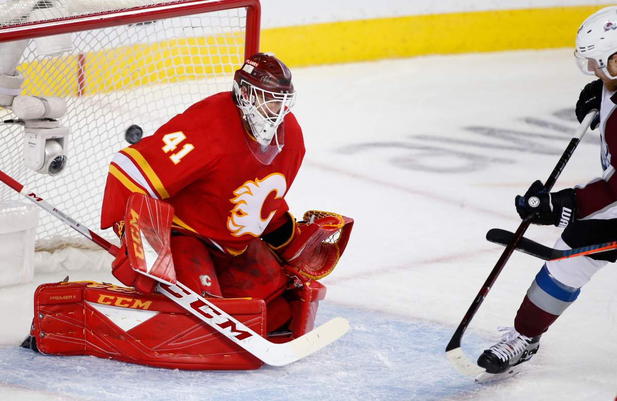 Colorado Avalanche left wing Gabriel Landeskog, right, watches a shot by teammate Colin Wilson score on Calgary Flames goalie Mike Smith during second period NHL playoff action in Calgary, Alta., Friday, Apirl 19, 2019. Calgary's first opponent of the 2019-20 season is the Colorado Avalanche, which is a team that conjures unpleasant memories for the Flames and their fans. 