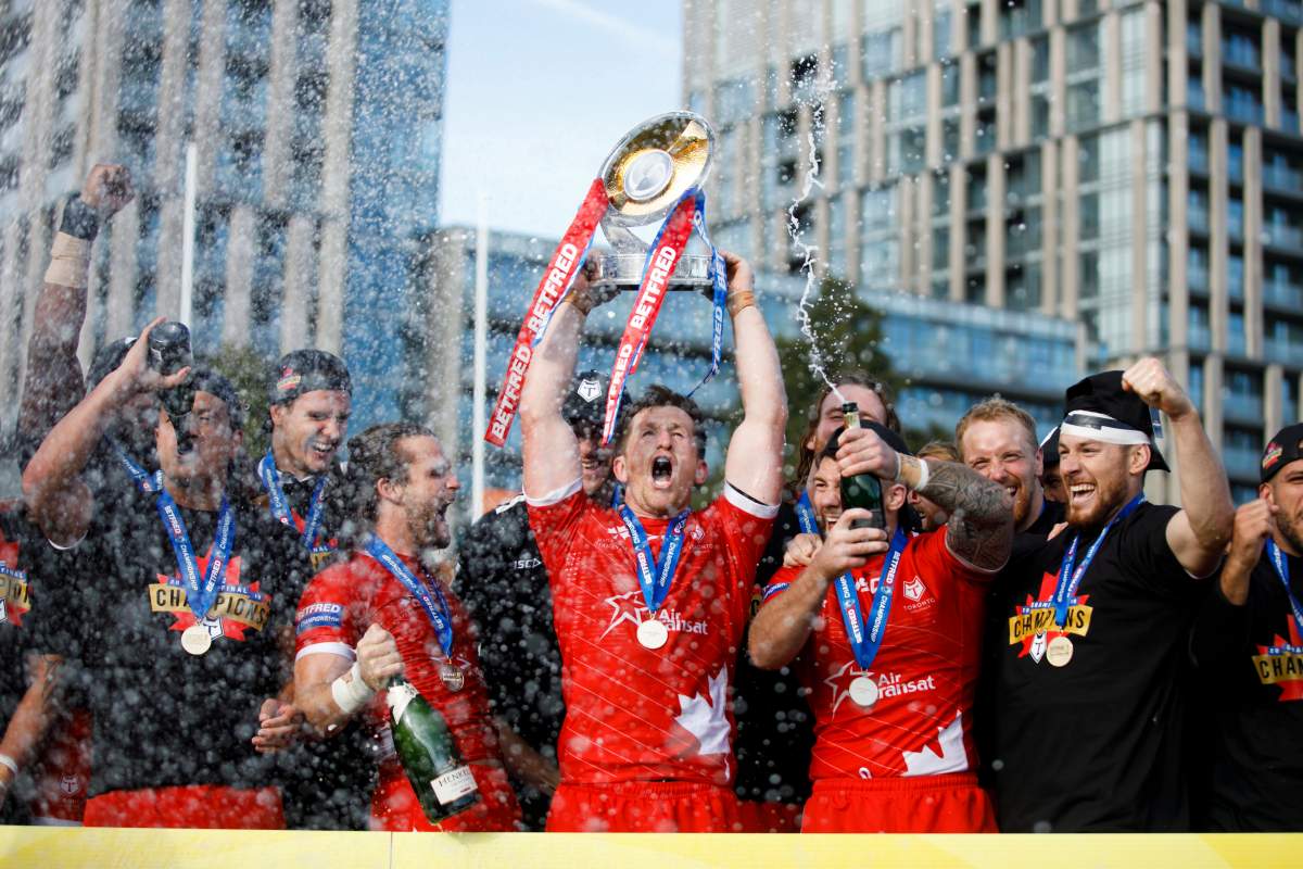 Toronto Wolfpack captain Josh McCrone raises the Betfred Championship Trophy alongside teammates after defeating the Featherstone Rovers in the Million Pound Game in Betfred Championship rugby league action in Toronto, Saturday, Oct. 5, 2019.