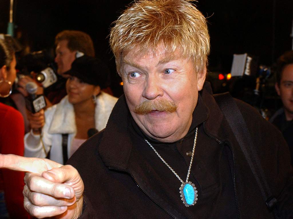 In this Monday, Oct. 21, 2002, file photo, comedian Rip Taylor talks with reporters before a film premiere, in the Hollywood section of Los Angeles. Taylor, the mustached comedian with a fondness for confetti-throwing who became a television game show mainstay in the 1970s, died Sunday, Oct. 6, 2019. He was 84.
