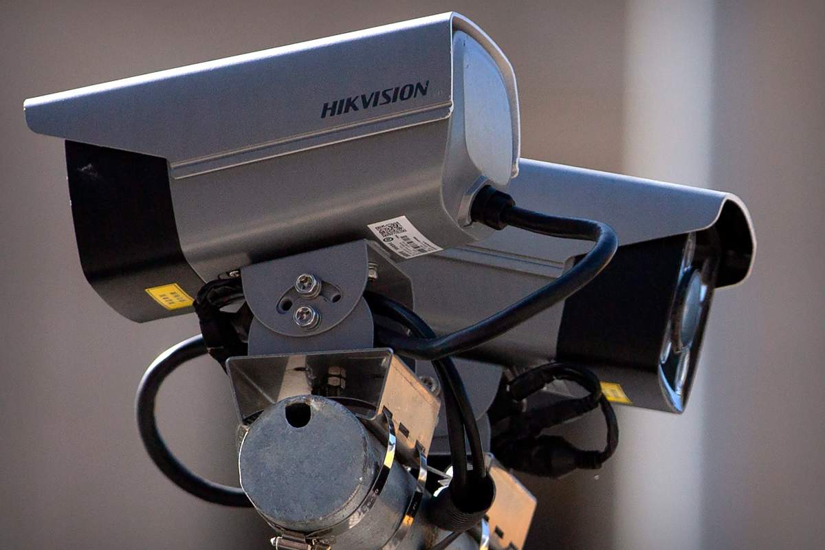 Hikvision security cameras monitor a pedestrian shopping street in Beijing, Tuesday, Oct. 8, 2019.