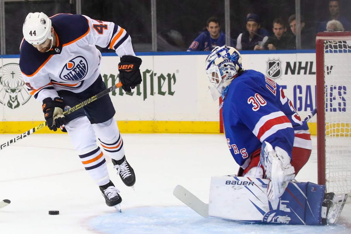 New York Rangers goaltender Henrik Lundqvist (30) defends against Edmonton Oilers right wing Zack Kassian (44) during the first period of an NHL hockey game, Saturday, Oct. 12, 2019, at Madison Square Garden in New York. (AP Photo/Mary Altaffer).