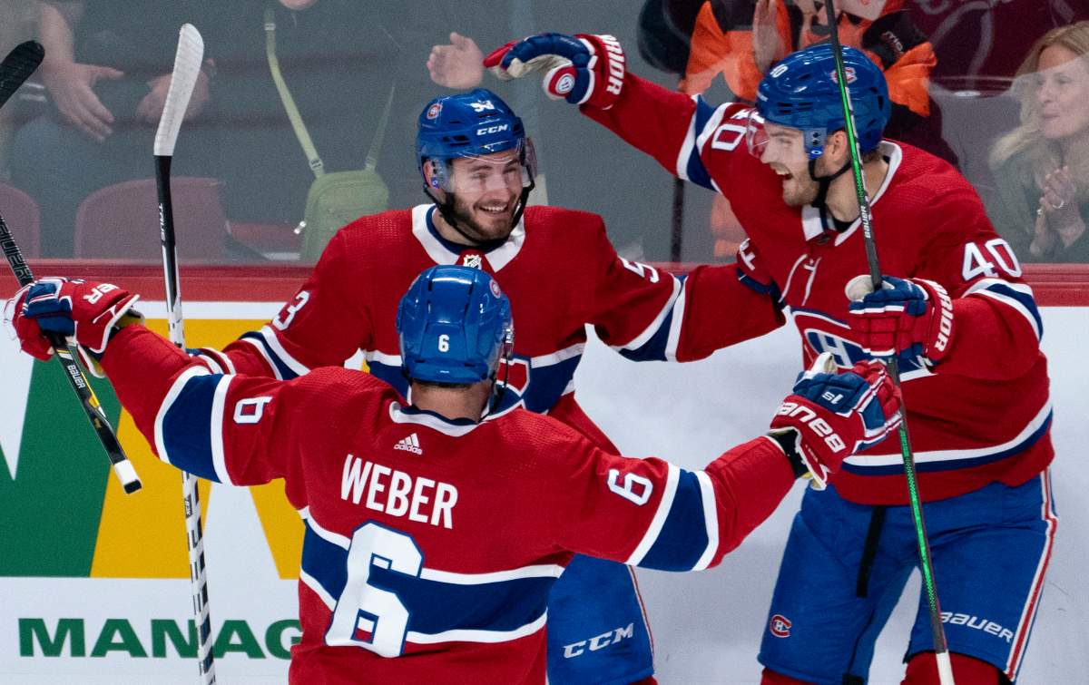 Montreal Canadiens' Victor Mete celebrates his goal against the Minnesota Wild with teammates Shea Weber, left, and Joel Armia, right, during first period NHL hockey action in Montreal on Thursday, October 17, 2019. 